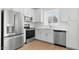Bright kitchen featuring stainless steel appliances, white cabinetry, and a subway tile backsplash at 2823 W Eagle Talon Rd, Phoenix, AZ 85085
