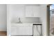 A kitchenette with white cabinets, stainless steel appliances, and a countertop at 2823 W Eagle Talon Rd, Phoenix, AZ 85085