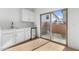 A well lit kitchenette with stainless steel appliances and a view to the exterior at 2823 W Eagle Talon Rd, Phoenix, AZ 85085