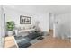 Spacious living room with a sofa, a rug, and hardwood floors at 2823 W Eagle Talon Rd, Phoenix, AZ 85085