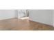Open-concept living room with wood-look flooring and lots of natural light at 2823 W Eagle Talon Rd, Phoenix, AZ 85085