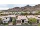 Aerial view of the home highlighting its well-maintained landscaping and scenic mountain backdrop at 3120 E Squaw Peak Cir, Phoenix, AZ 85016