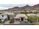 Aerial view of the home highlighting its well-maintained landscaping and scenic mountain backdrop at 3120 E Squaw Peak Cir, Phoenix, AZ 85016