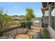 Backyard features a built-in stainless steel BBQ and patio in a beautifully landscaped outdoor space at 3120 E Squaw Peak Cir, Phoenix, AZ 85016
