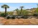 Beautiful backyard featuring a serene rock waterfall and desert landscaping at 3120 E Squaw Peak Cir, Phoenix, AZ 85016