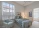 Cozy bedroom with neutral walls, plush carpet, ceiling fan and shuttered window at 3120 E Squaw Peak Cir, Phoenix, AZ 85016