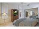 Bedroom featuring a television, mirrored closet and door to ensuite bathroom at 3120 E Squaw Peak Cir, Phoenix, AZ 85016