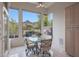Bright breakfast nook with mountain views from large picture windows and a glass table with seating at 3120 E Squaw Peak Cir, Phoenix, AZ 85016