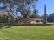 The Biltmore Estates community sign surrounded by cacti, desert landscaping and a green lawn at 3120 E Squaw Peak Cir, Phoenix, AZ 85016