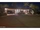 Elegant community entrance at night, showcasing manicured landscaping and a welcoming ambiance at 3120 E Squaw Peak Cir, Phoenix, AZ 85016