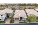 Aerial view of home with lush landscaping, two-car garage, desert landscape in background at 3120 E Squaw Peak Cir, Phoenix, AZ 85016