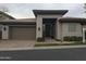 Charming home with modern architecture, attached garage, desert landscaping, and inviting entrance at 3120 E Squaw Peak Cir, Phoenix, AZ 85016