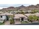 Charming single-story home with a well-manicured front yard and an attached two-car garage at 3120 E Squaw Peak Cir, Phoenix, AZ 85016