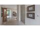Hallway view showcases tile floors, artwork, and an open floor plan connecting living spaces for easy flow at 3120 E Squaw Peak Cir, Phoenix, AZ 85016