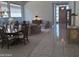 Living room with elegant dining area, tile floors, carpet, and decorative furnishings at 3120 E Squaw Peak Cir, Phoenix, AZ 85016