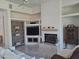 Living room with fireplace, built-in shelving and media center at 3120 E Squaw Peak Cir, Phoenix, AZ 85016