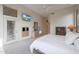 Bright main bedroom with ensuite bathroom and balcony access at 3120 E Squaw Peak Cir, Phoenix, AZ 85016