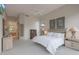 Spacious main bedroom with neutral tones, carpet and ensuite bathroom at 3120 E Squaw Peak Cir, Phoenix, AZ 85016