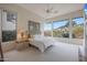 Bright main bedroom boasting an abundance of natural light from large windows at 3120 E Squaw Peak Cir, Phoenix, AZ 85016