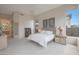 Neutral main bedroom featuring carpet, a ceiling fan and ensuite bath at 3120 E Squaw Peak Cir, Phoenix, AZ 85016