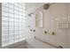 Shower featuring white tile, glass block accent window, and chrome fixtures at 3120 E Squaw Peak Cir, Phoenix, AZ 85016