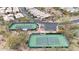 Aerial view of well-maintained tennis courts with desert landscape and nearby parking at 3120 E Squaw Peak Cir, Phoenix, AZ 85016