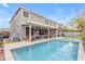 Large backyard features a sparkling pool, covered patio, and ample space for entertaining and recreation at 3555 E Gary Way, Gilbert, AZ 85234