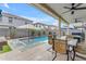 Inviting backyard with a sparkling pool, desert landscaping, and a charming outdoor dining area at 3555 E Gary Way, Gilbert, AZ 85234