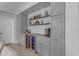 Home bar area featuring gray cabinets, a built-in wine cooler, and stylish decor at 3555 E Gary Way, Gilbert, AZ 85234