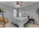 Bedroom featuring a ceiling fan, rocking chair, and neutral decor at 3555 E Gary Way, Gilbert, AZ 85234
