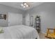 Bedroom featuring a ceiling fan, rocking chair, sliding door closet and neutral decor at 3555 E Gary Way, Gilbert, AZ 85234