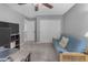 Relaxing bedroom with a futon, carpeted floors, and bright natural light at 3555 E Gary Way, Gilbert, AZ 85234