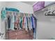 Functional closet featuring shelving, hanging storage, and a dark wood dresser at 3555 E Gary Way, Gilbert, AZ 85234