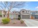 Charming two-story home featuring neutral color scheme, two-car garage, and beautiful landscaping at 3555 E Gary Way, Gilbert, AZ 85234