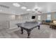 Spacious game room featuring a ping pong table, comfortable seating, and great natural light at 3555 E Gary Way, Gilbert, AZ 85234
