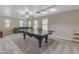 Spacious game room with a ping pong table, a ceiling fan and wall-to-wall carpeting at 3555 E Gary Way, Gilbert, AZ 85234