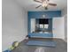 Home gym featuring a large mirror, free weights, and a blue accent wall at 3555 E Gary Way, Gilbert, AZ 85234