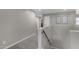 Upstairs hallway featuring carpet flooring and neutral paint, with access to bedrooms and other rooms at 3555 E Gary Way, Gilbert, AZ 85234