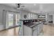 Kitchen with island seating, stainless steel appliances, and access to outdoor living area at 3555 E Gary Way, Gilbert, AZ 85234