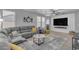 Comfortable living room with a large sectional couch, modern decor, and plenty of natural light at 3555 E Gary Way, Gilbert, AZ 85234