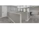 Upstairs loft area featuring carpet flooring, neutral paint, and a view to a game room with a ping pong table at 3555 E Gary Way, Gilbert, AZ 85234