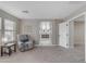 Light-filled main bedroom with a glimpse of a bathroom through an open doorway at 3555 E Gary Way, Gilbert, AZ 85234