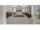 Spacious main bedroom with carpeted floors, and a bed with lamps on the nightstands at 3555 E Gary Way, Gilbert, AZ 85234