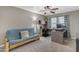 Home office with neutral walls, built-in desk, and comfortable futon for guests at 3555 E Gary Way, Gilbert, AZ 85234