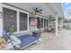 Relaxing outdoor patio featuring a lounge chair, a fire pit, and a ceiling fan at 3555 E Gary Way, Gilbert, AZ 85234