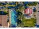 Overhead view of pool, lawn, playground with sunshade, and tree-lined walkways in a beautiful community at 37036 N Stoneware Dr, Queen Creek, AZ 85140