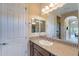 Bathroom vanity features a sink, granite countertops, and a decorative backsplash at 37036 N Stoneware Dr, Queen Creek, AZ 85140