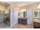 Main bathroom featuring a walk-in shower, granite countertops, and dual sinks at 37036 N Stoneware Dr, Queen Creek, AZ 85140