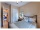 Comfortable bedroom with soft decor, window, closet and view of other bedrooms at 37036 N Stoneware Dr, Queen Creek, AZ 85140