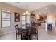 Cozy breakfast nook with backyard views adjacent to a gourmet kitchen featuring stainless steel appliances at 37036 N Stoneware Dr, Queen Creek, AZ 85140